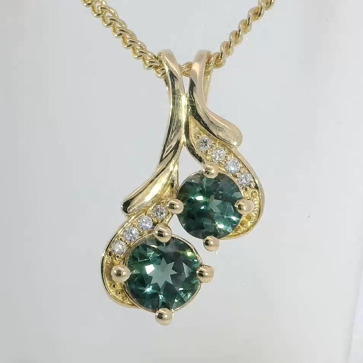 Exquisite 9ct Gold Pendant set with Teal Sapphires & Diamonds. M92195