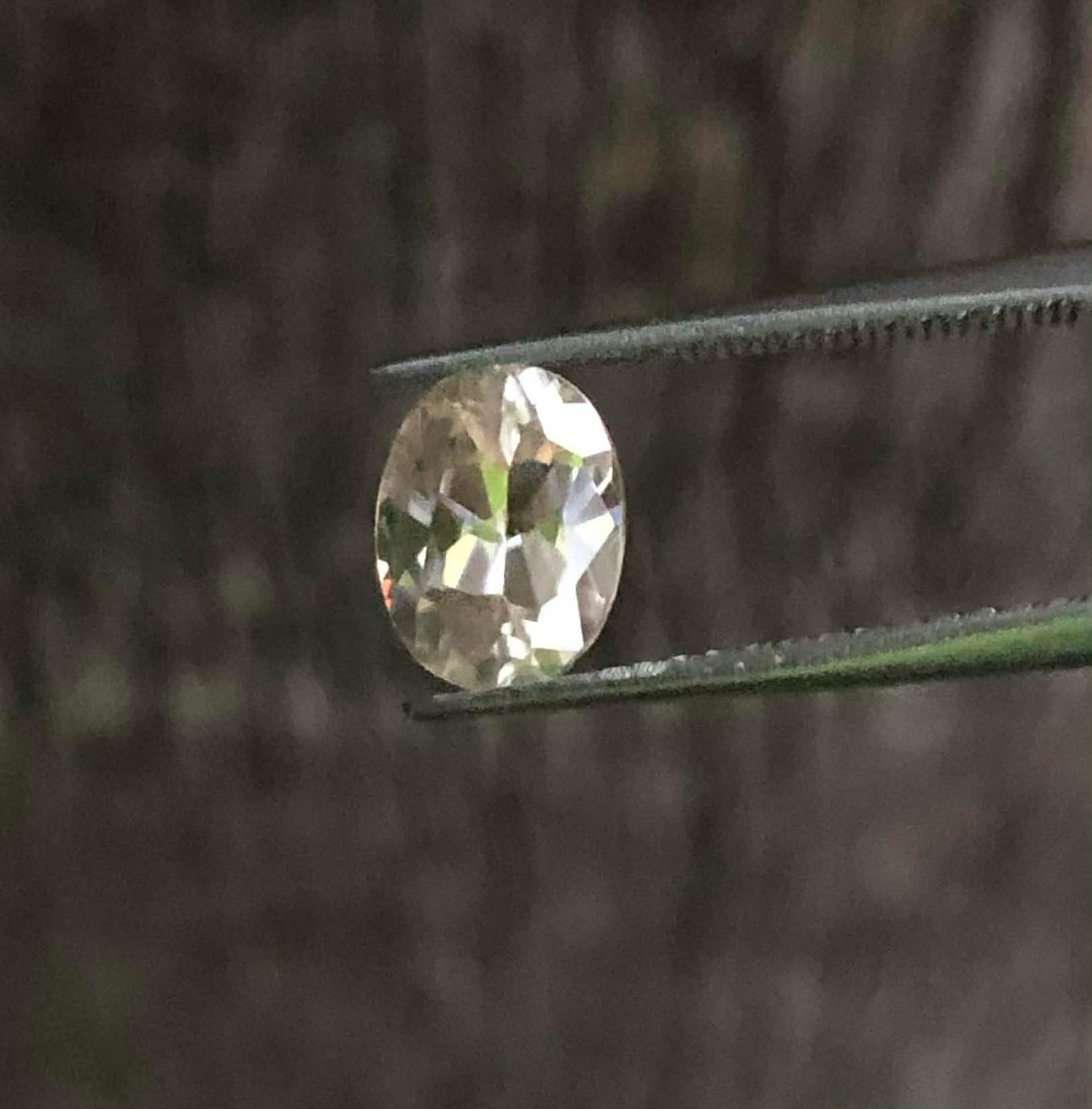 Faceted White with a Pink tinge Zircon. M1280
