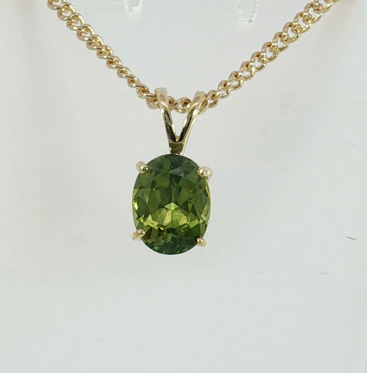 9ct Gold Pendant set with a Bright Green Sapphire. M92254