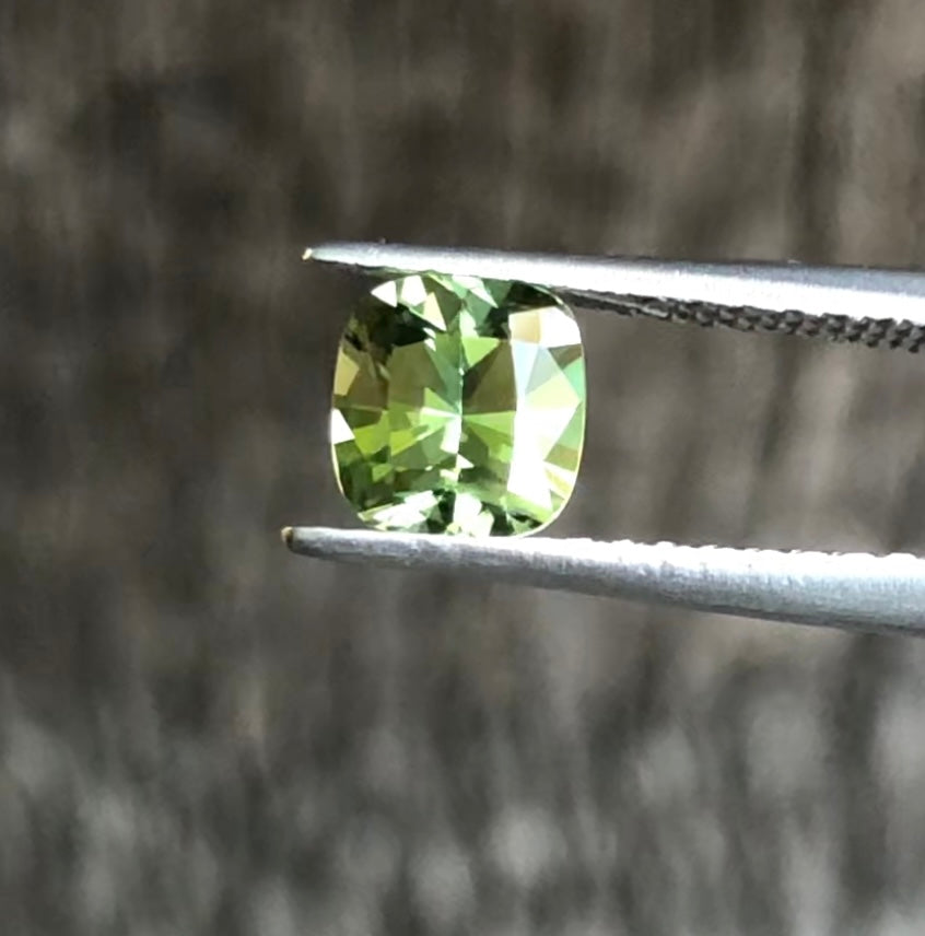Green with Yellow Highlights Cushion Cut Sapphire. M1225