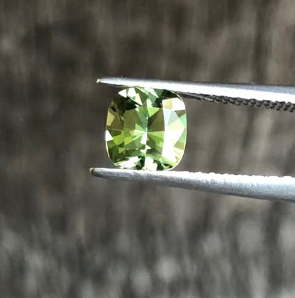 Green with Yellow Highlights Cushion Cut Sapphire. M1225