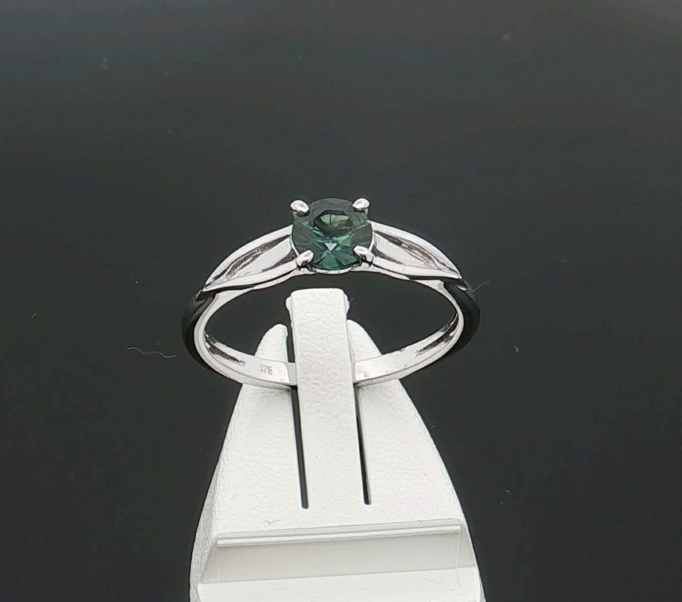 Teal Sapphire set in a 9ct White Gold Ring. M91818