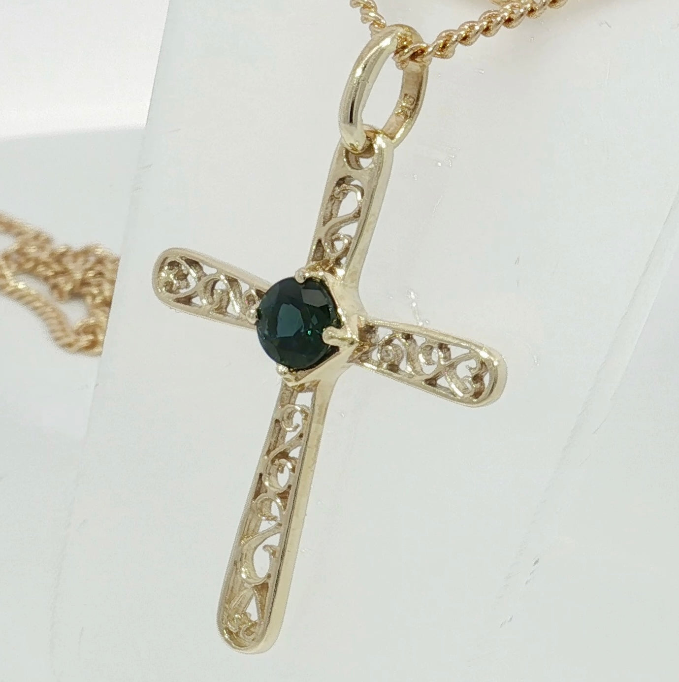 9ct Gold Cross Pendant set with a Bright Blue Sapphire. M91902