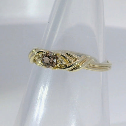 A 9ct gold ring featuring Diamonds and an Australian Zircon. M91966