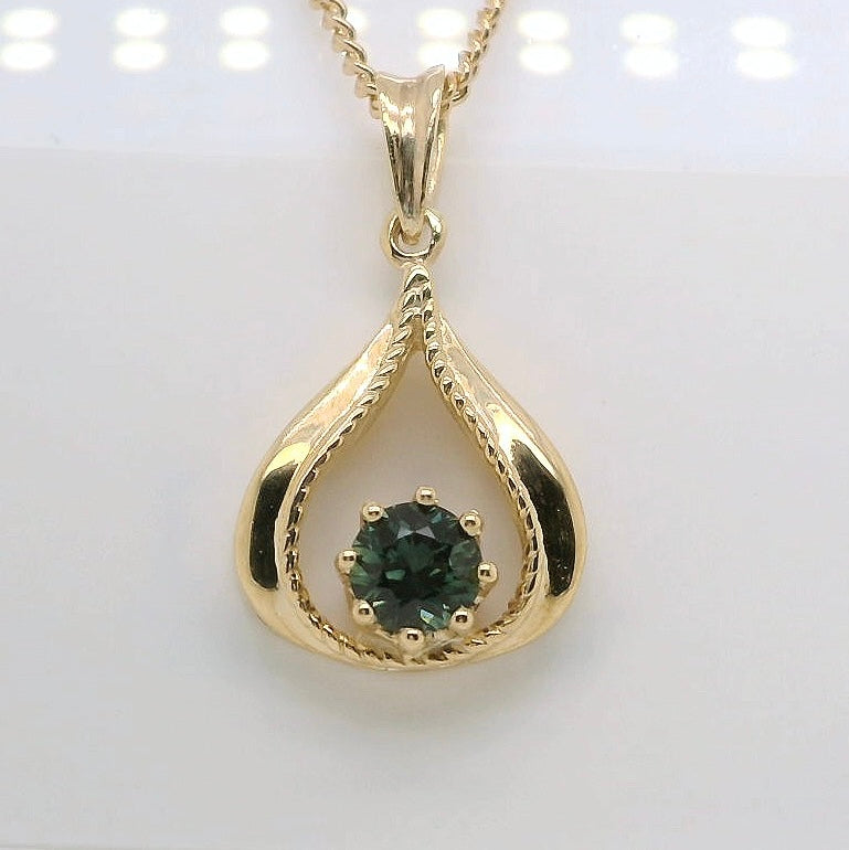 Elegant Pendant set with a Green Australian Sapphire. M92128