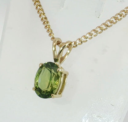 9ct Gold Pendant set with a Bright Green Sapphire. M92254